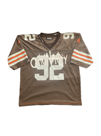 a brown jersey with the number 32 on it